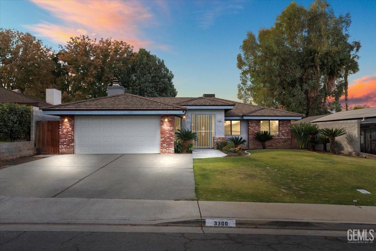 front view of a house with a yard