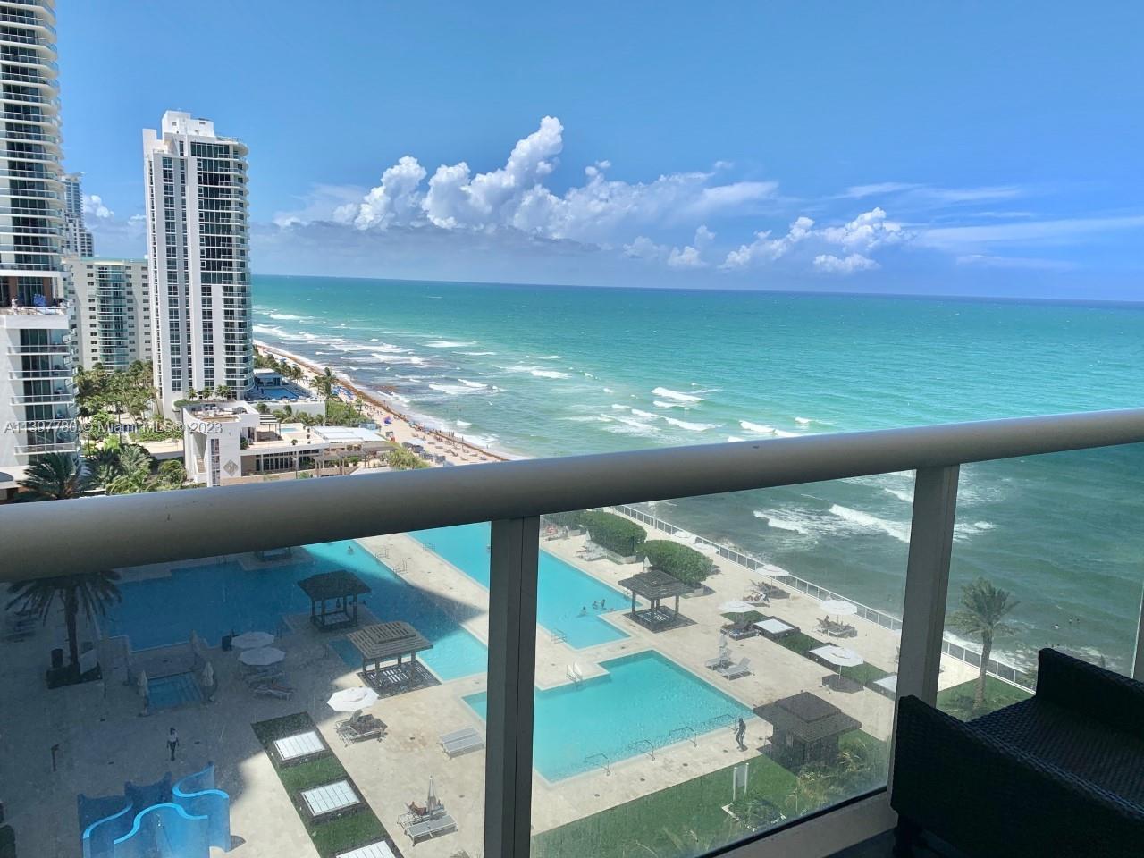 a view of a balcony with ocean view