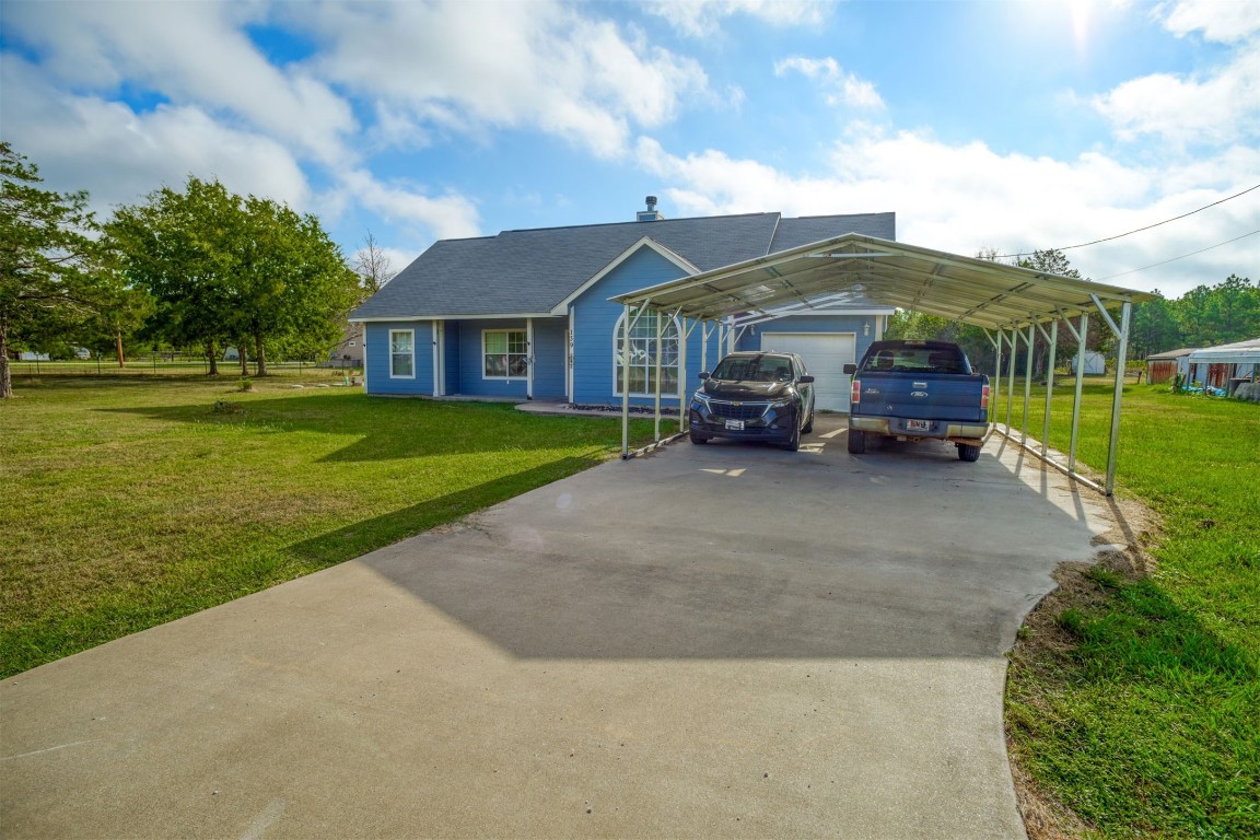 a front view of house with yard and green space