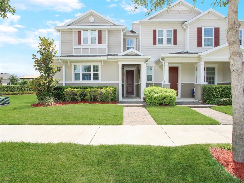 a front view of a house with a yard