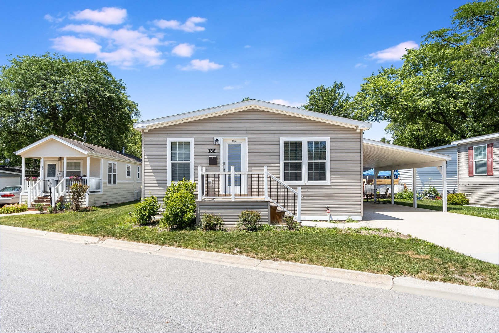 a front view of a house with a yard and porch