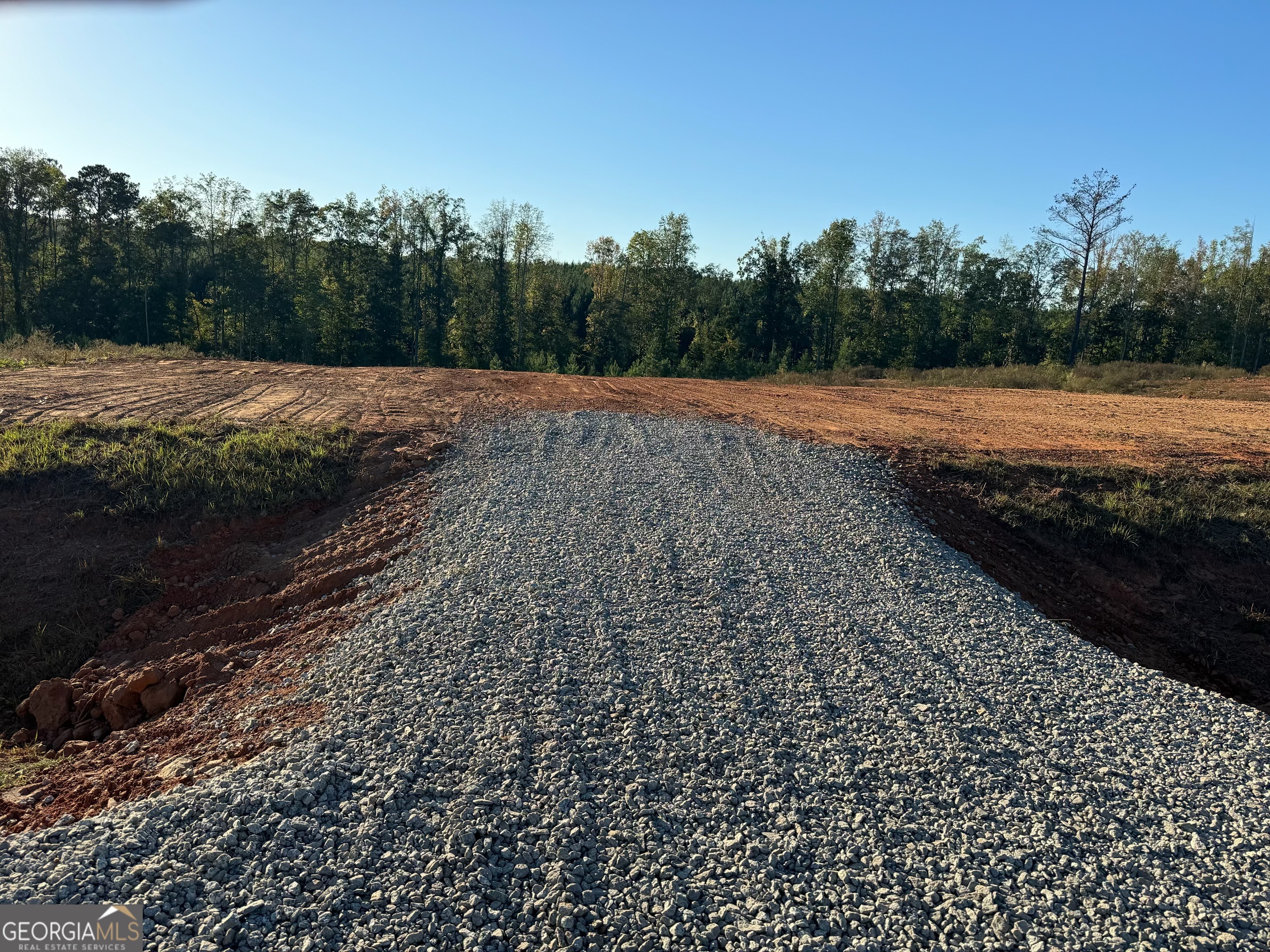 a view of a road with a yard