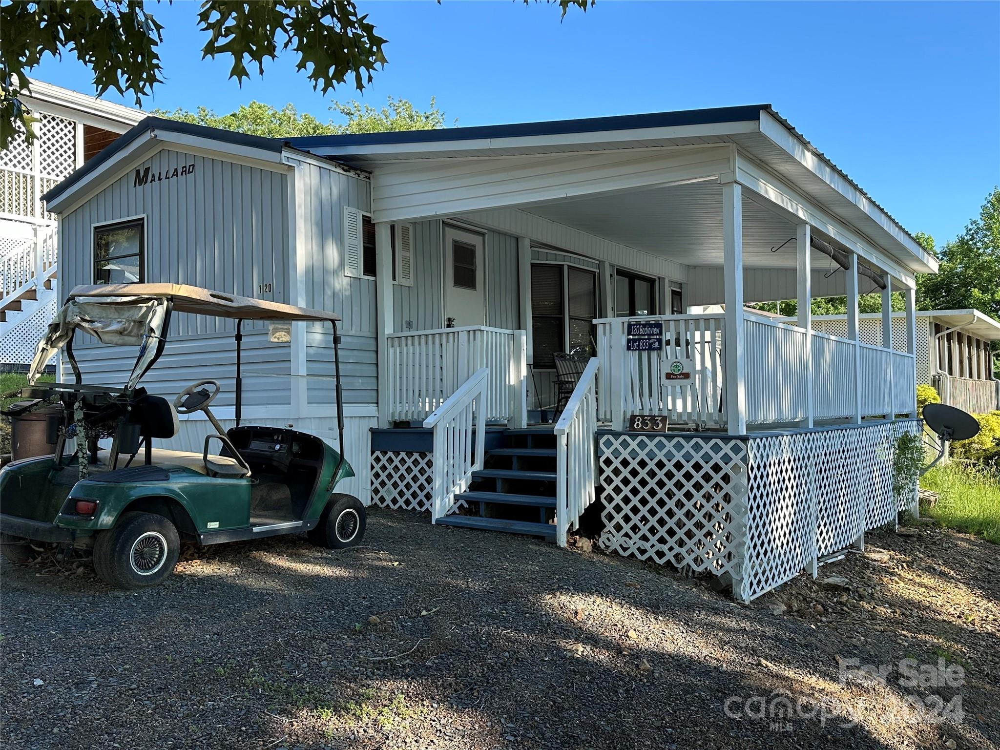 a view of a car park in front of house