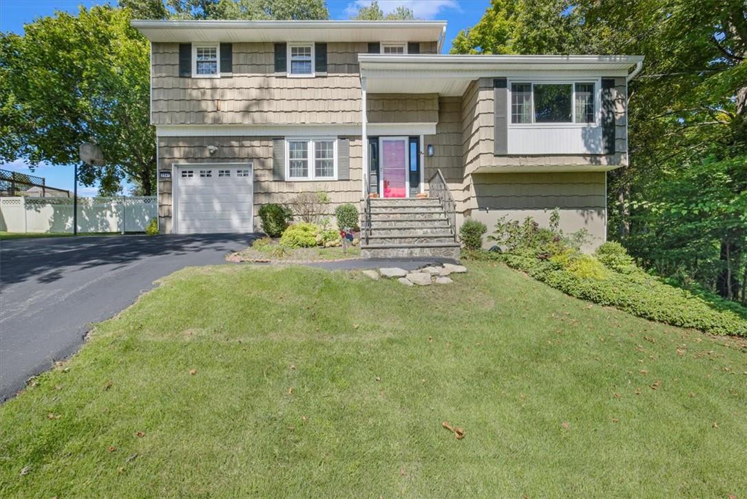 a front view of a house with a yard