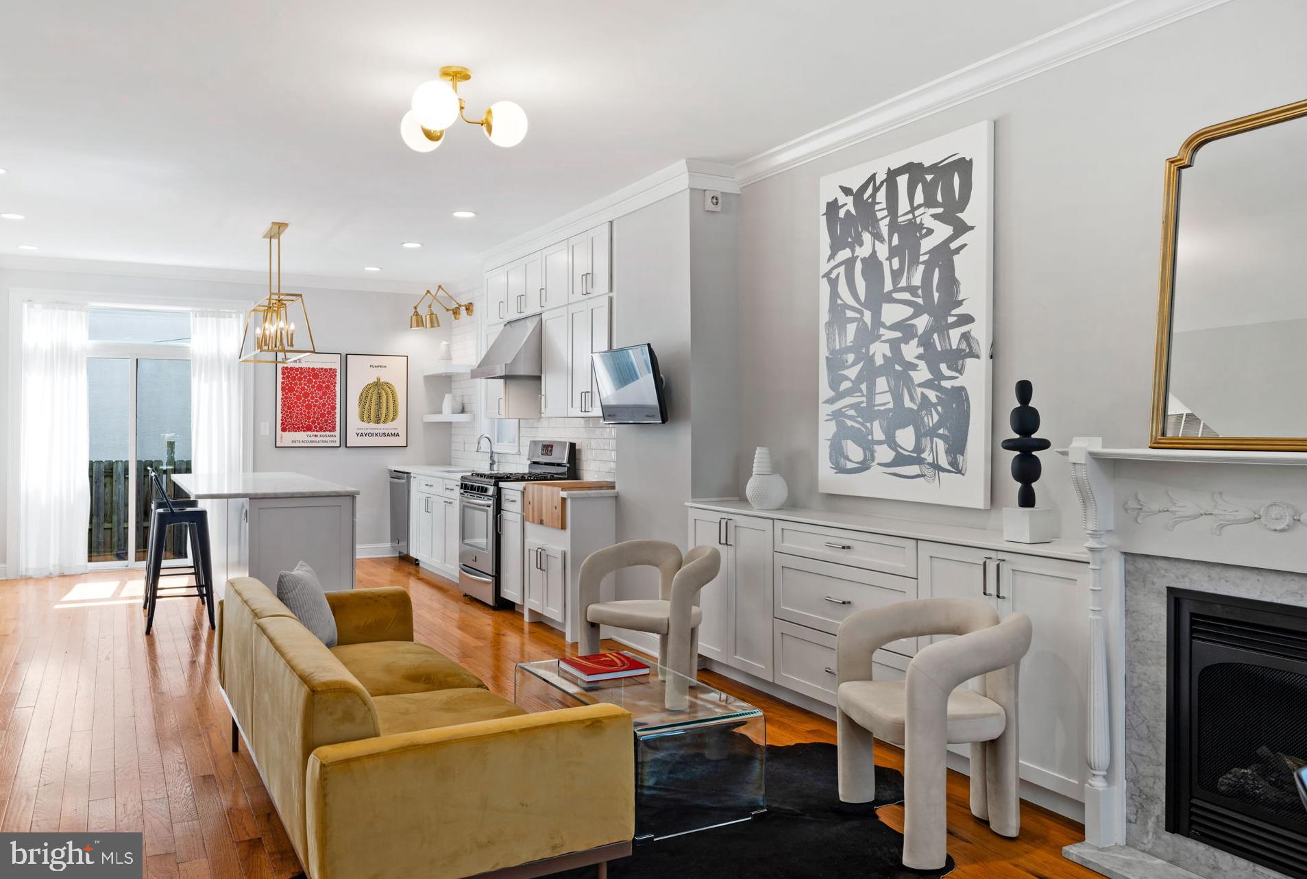 a living room with furniture a fireplace and a table