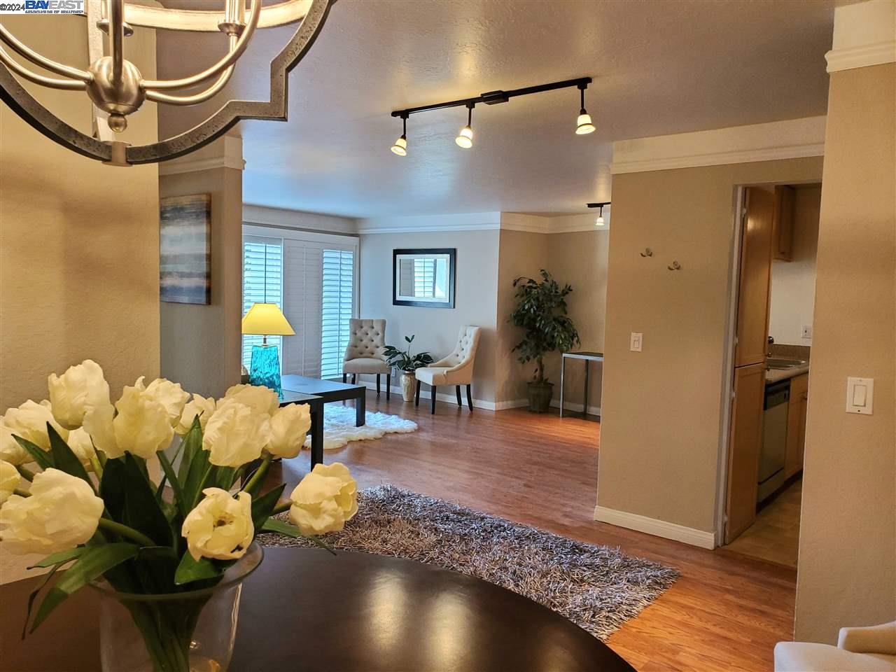 a living room with lots of furniture and a chandelier