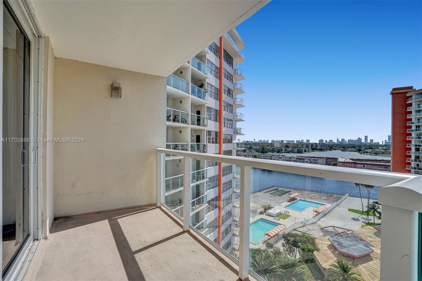 a view of balcony with furniture and city view