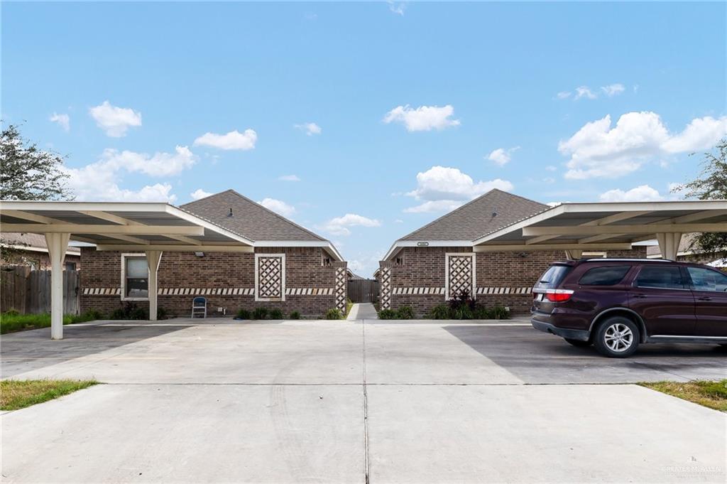 a view of a car park in front of house