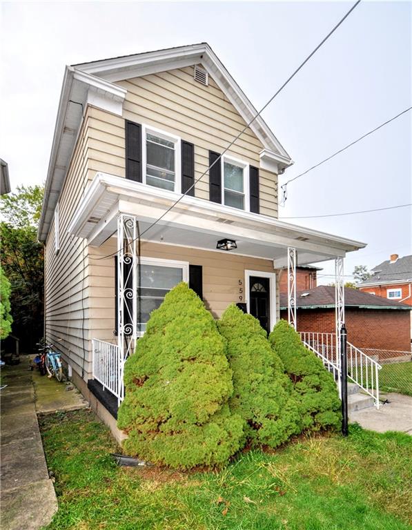 a front view of a house with a yard