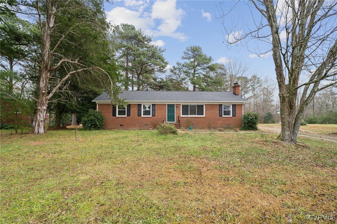 Single story home with a front lawn