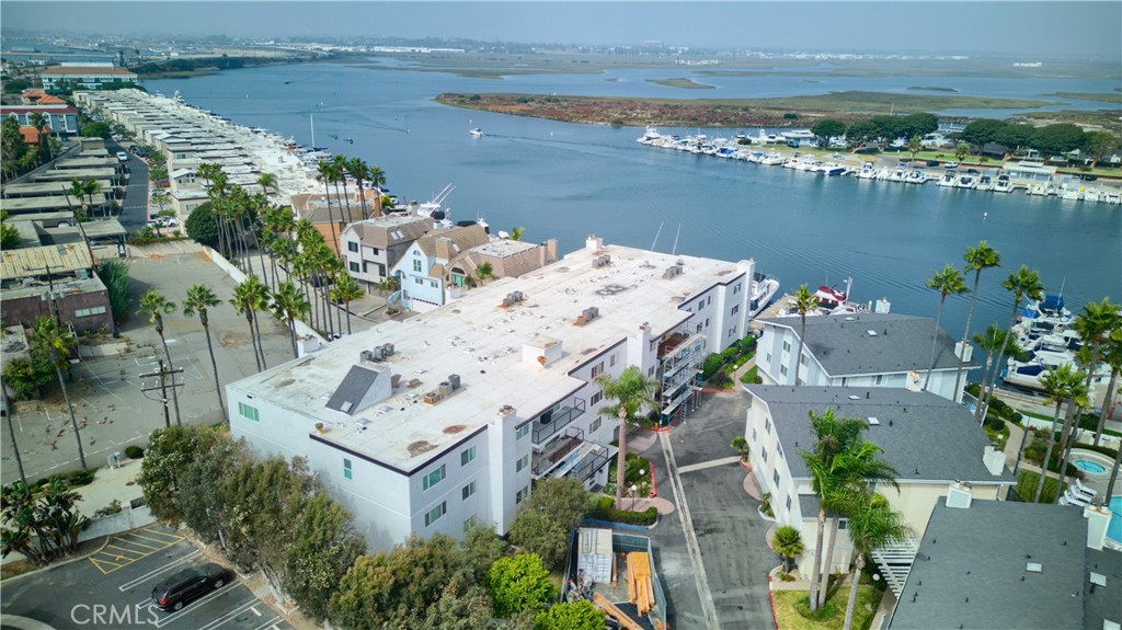 an aerial view of a house with a lake view