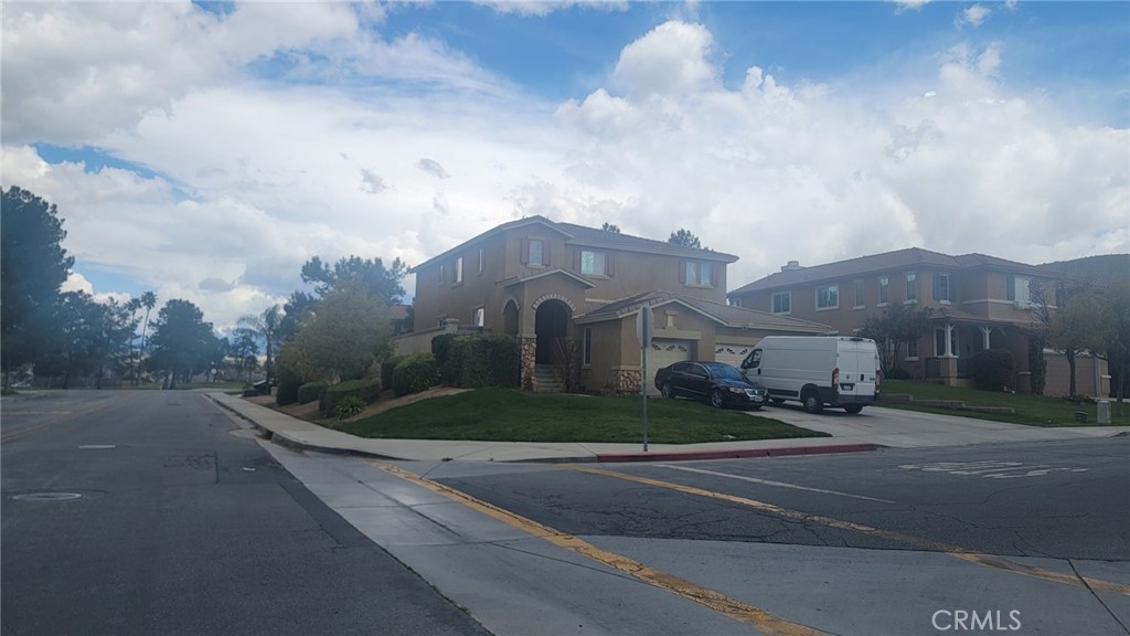 a view of a street in front of a house