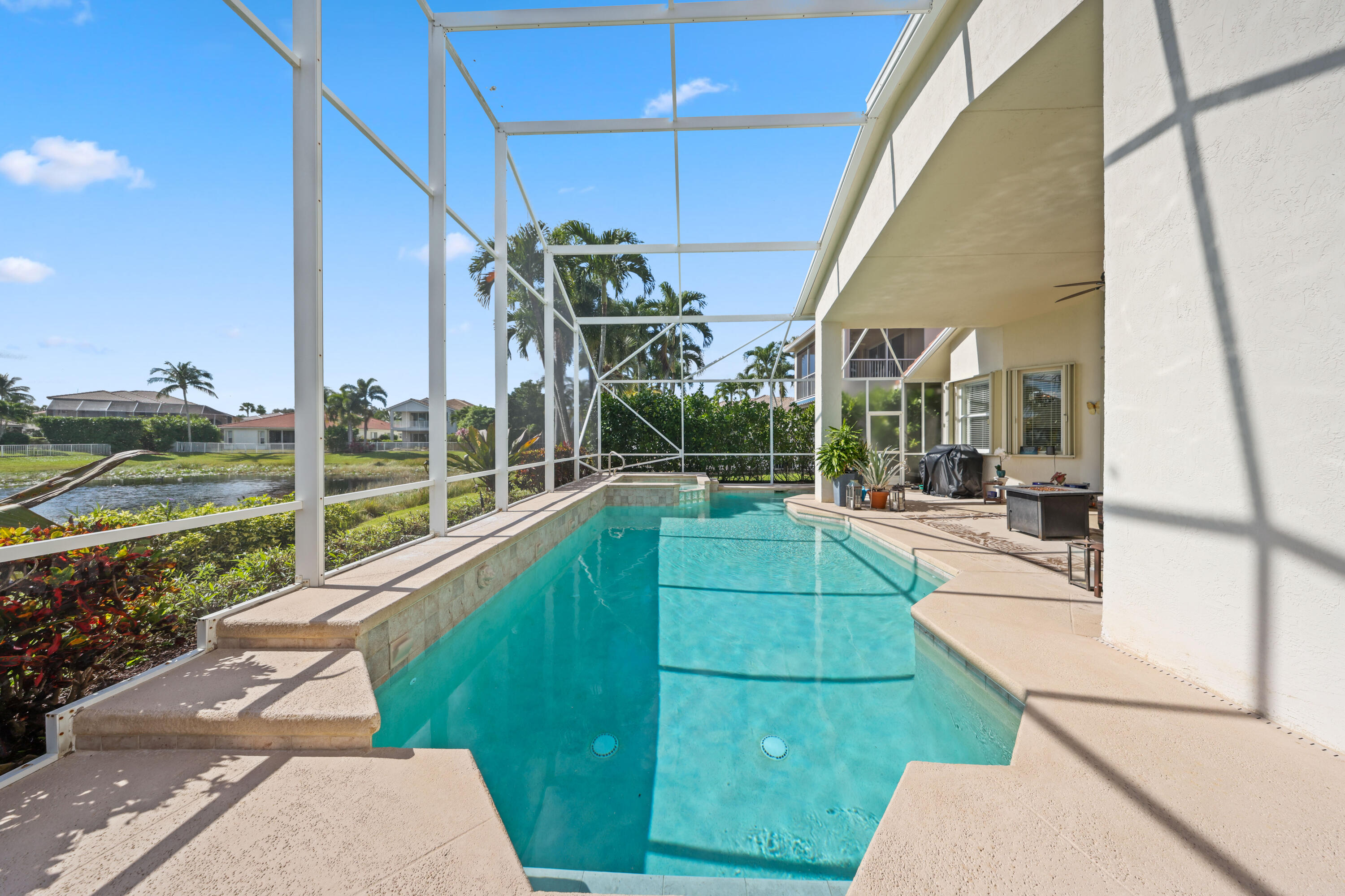 a view of a backyard with swimming pool