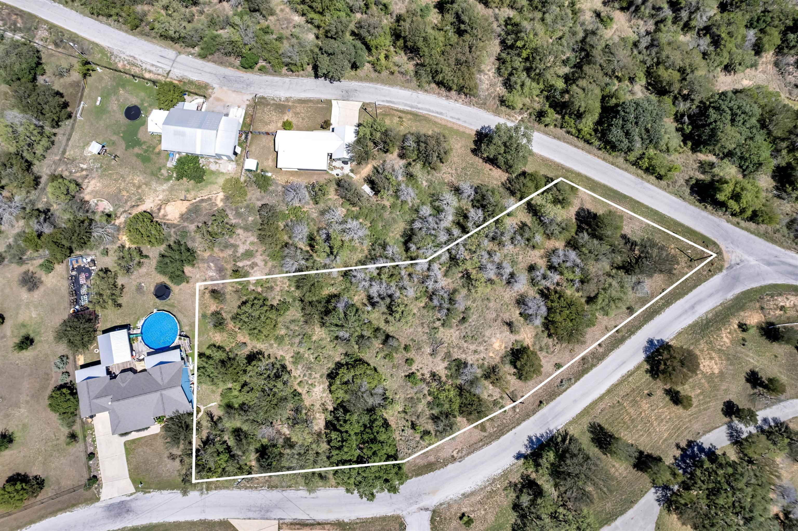 a view of a yard from a balcony