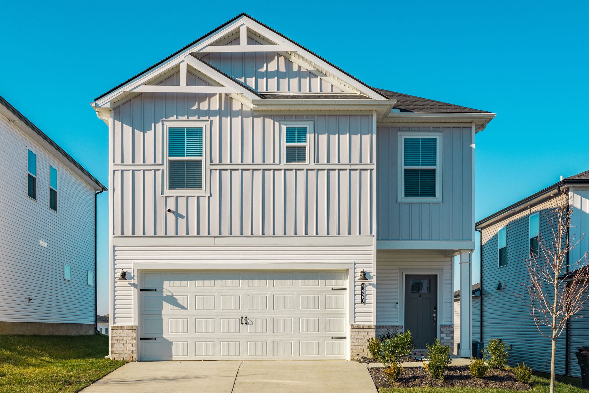 a front view of a house with a yard