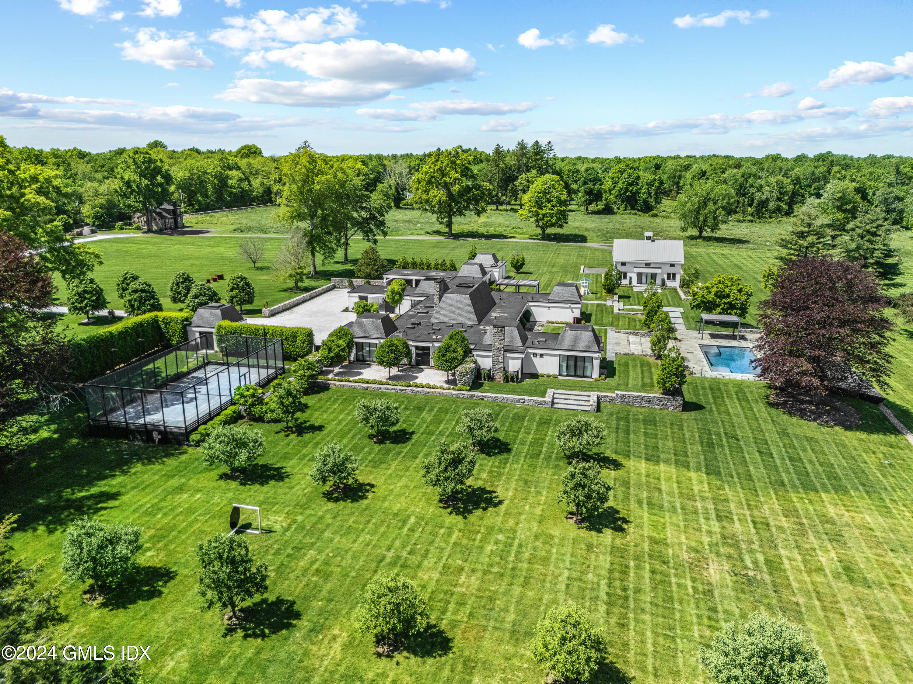 a view of a garden with an outdoor seating