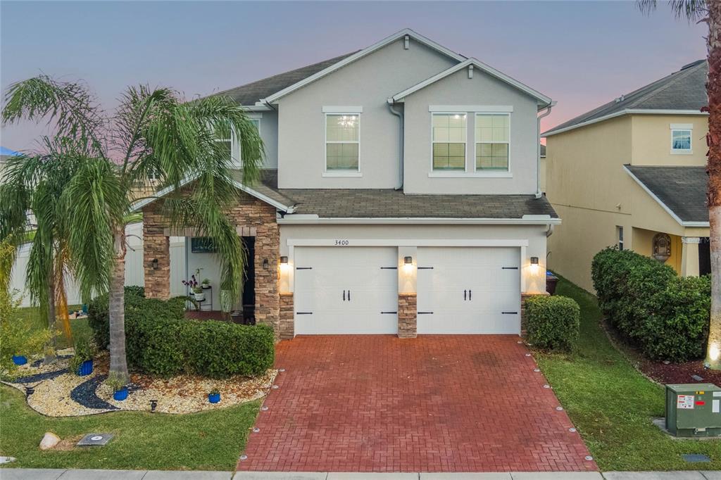 front view of a house with a yard