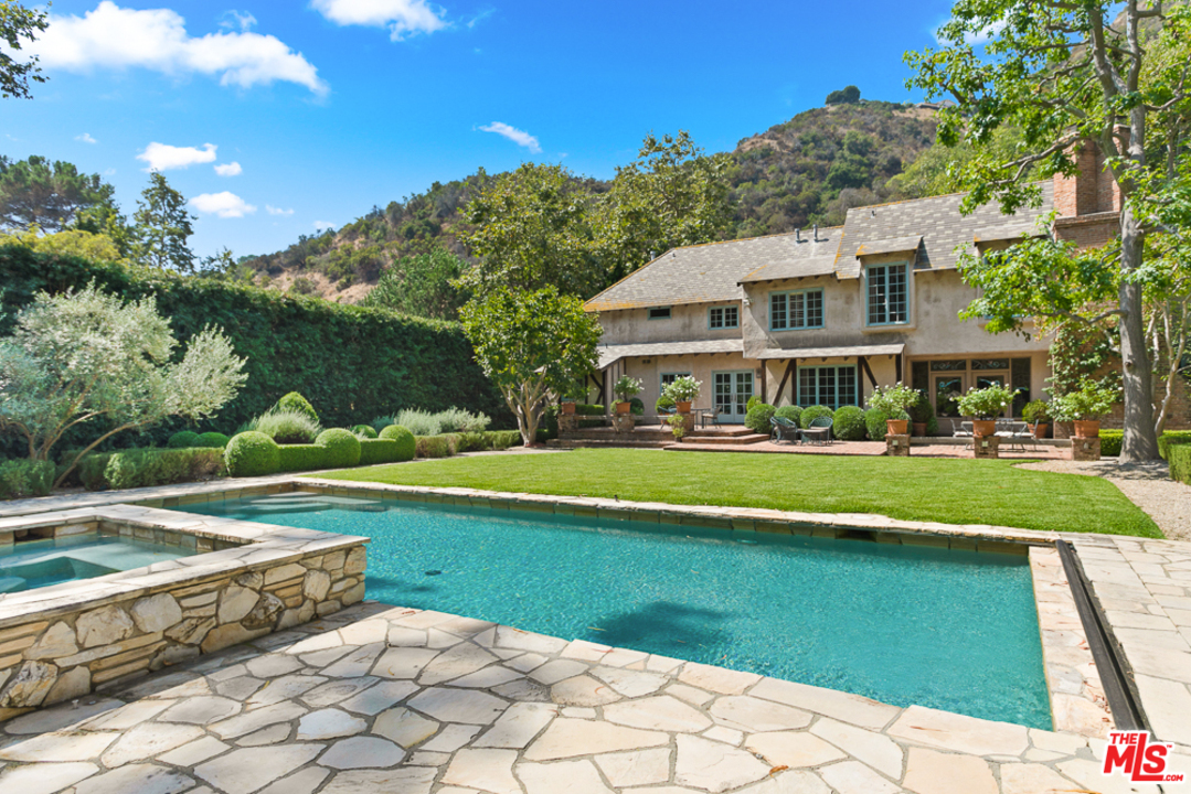 a view of a house with a swimming pool