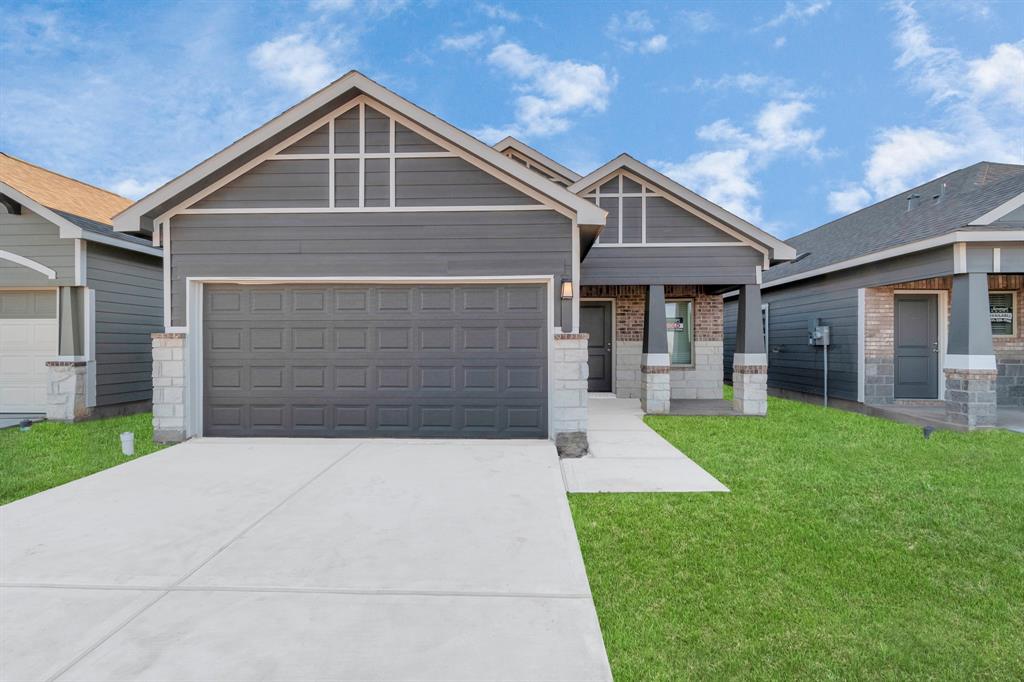 Welcome to your new home! This charming new construction by Saratoga Homes in Aldine Pines showcases the attractive Clover Floor Plan. Featuring a welcoming facade, modern architectural details, and a spacious two-car garage, this 4-bedroom, 2-bathroom home is a perfect blend of style and function. The clean lines and contemporary design elements set the stage for the beautiful interior waiting to be explored. **This image is from another Saratoga Home - Clover floorplan.**