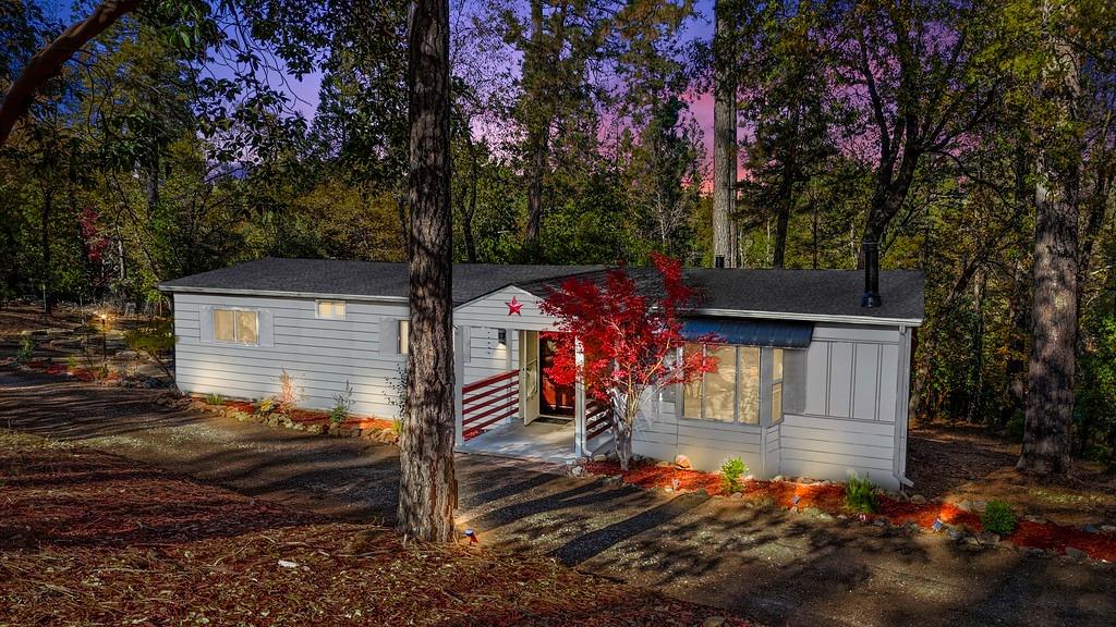 a view of a house with a yard