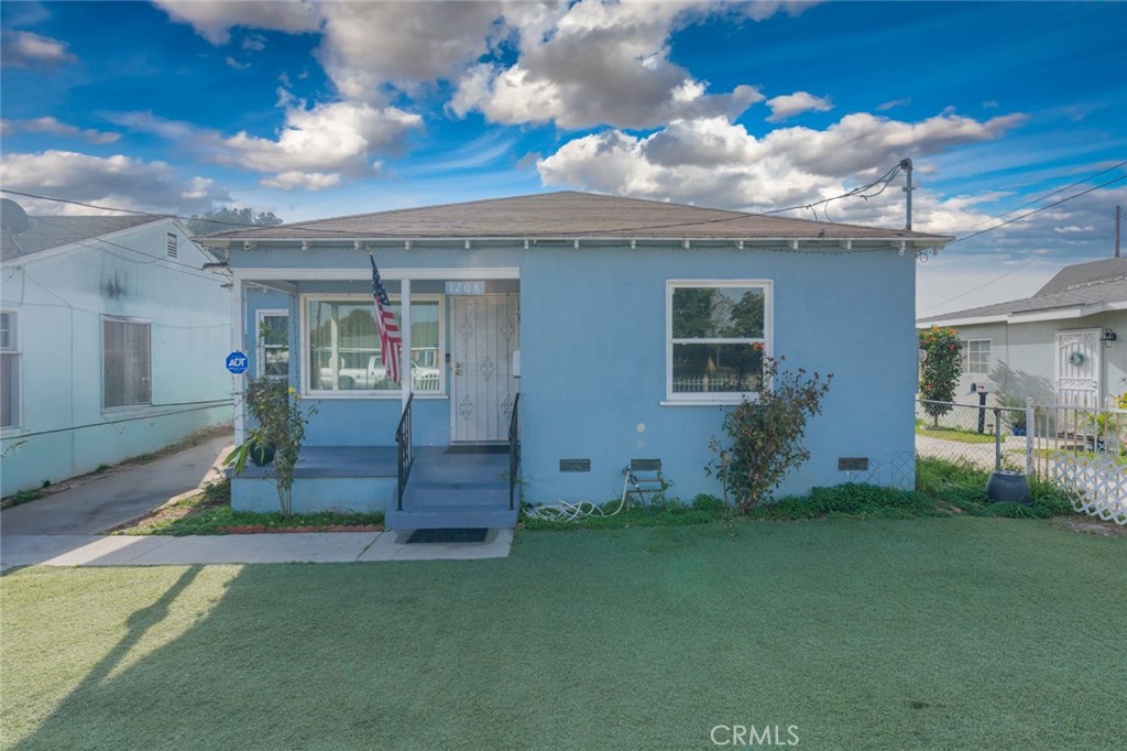 front view of a house with a yard