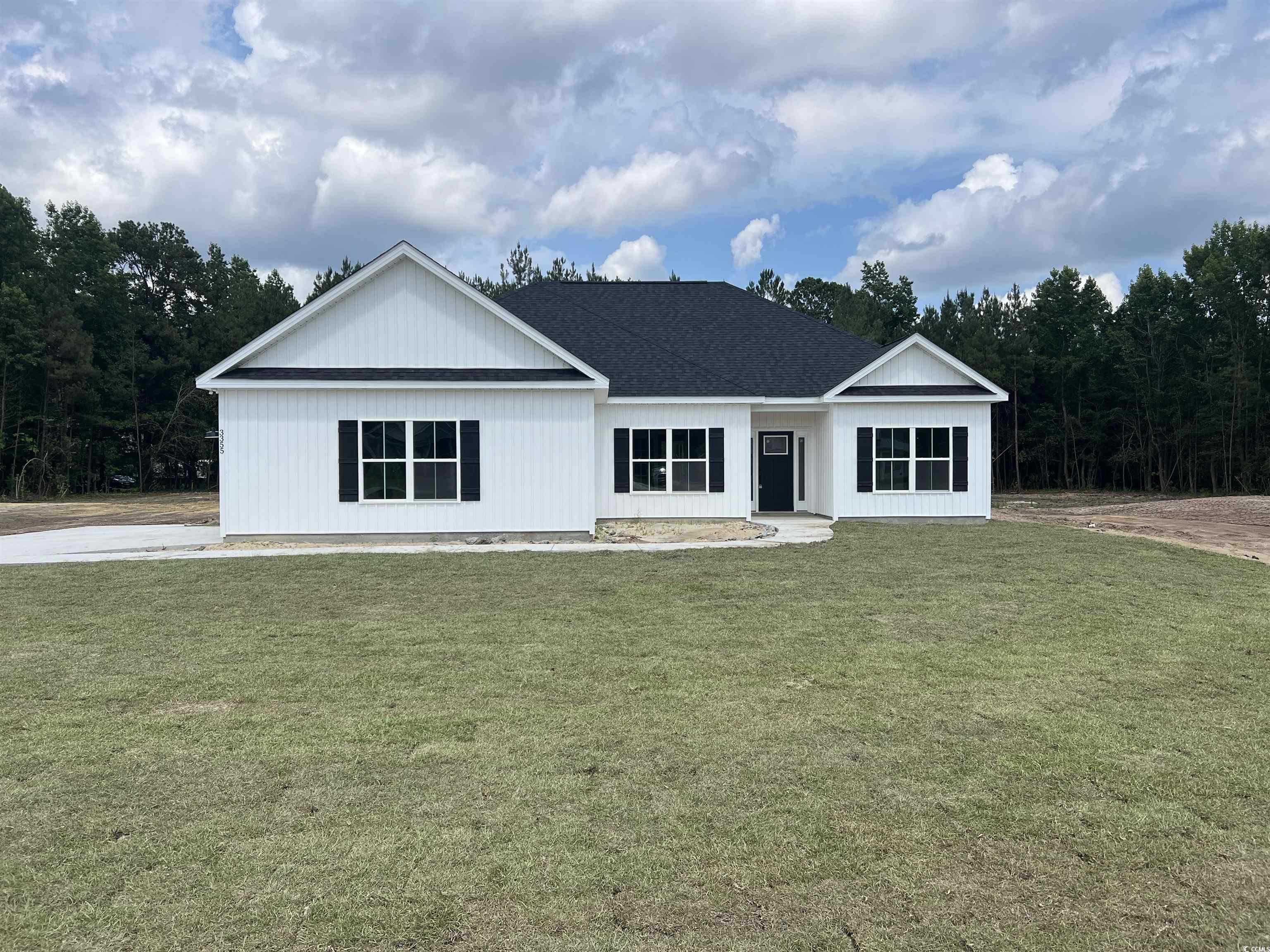 View of front of property with a front lawn