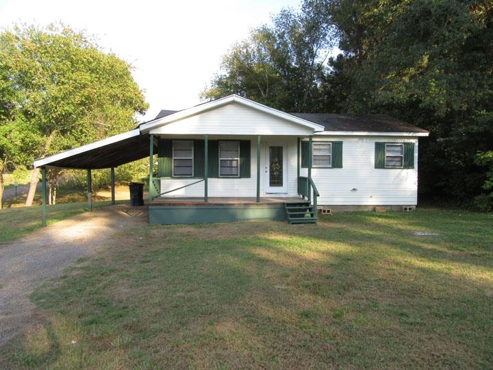 a front view of house with garden