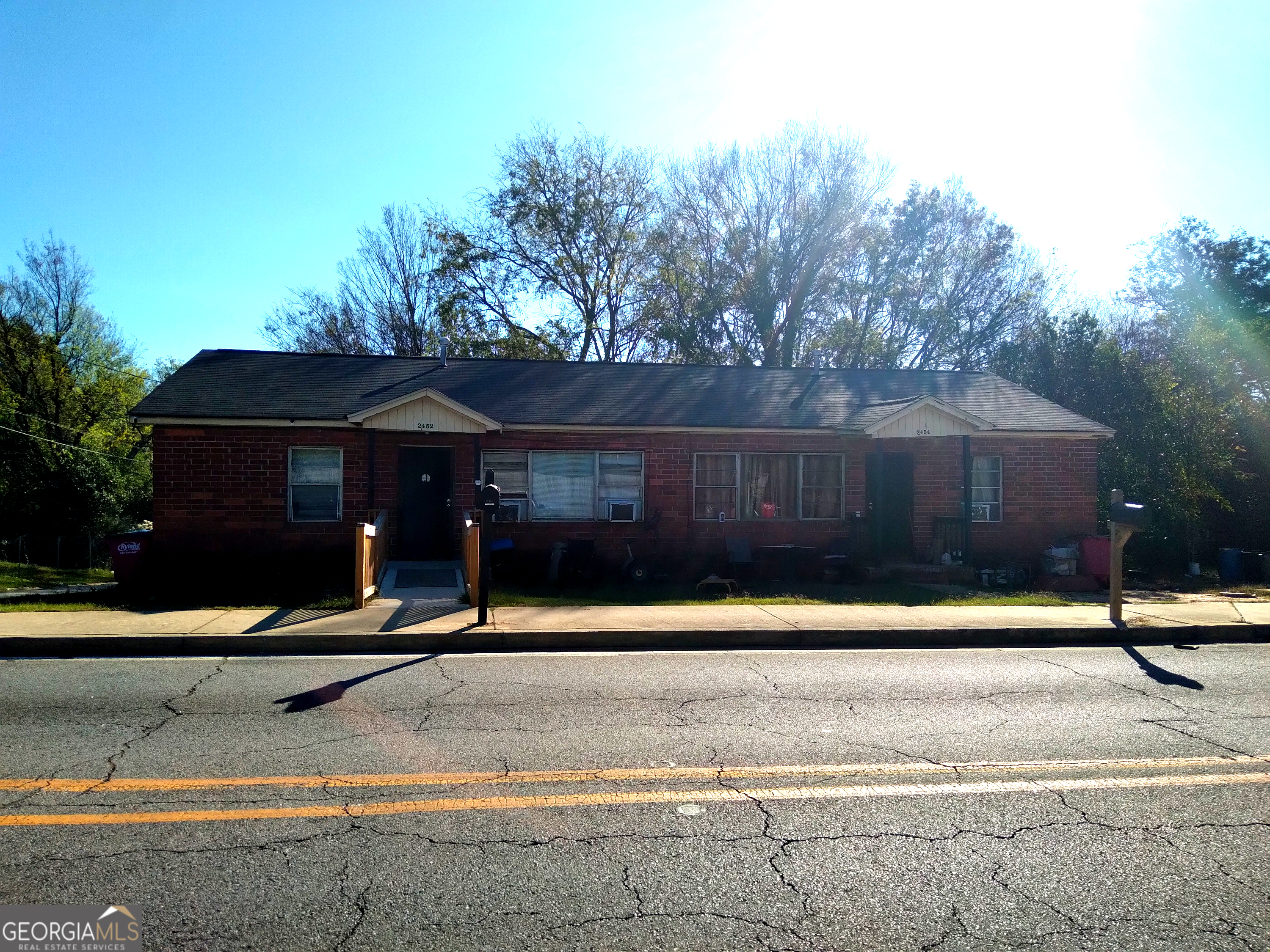 a front view of a house with garage