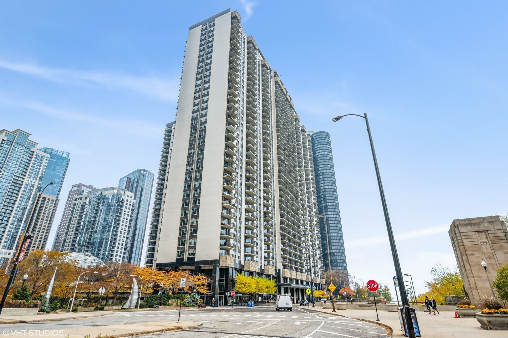 a view of a tall building next to a road