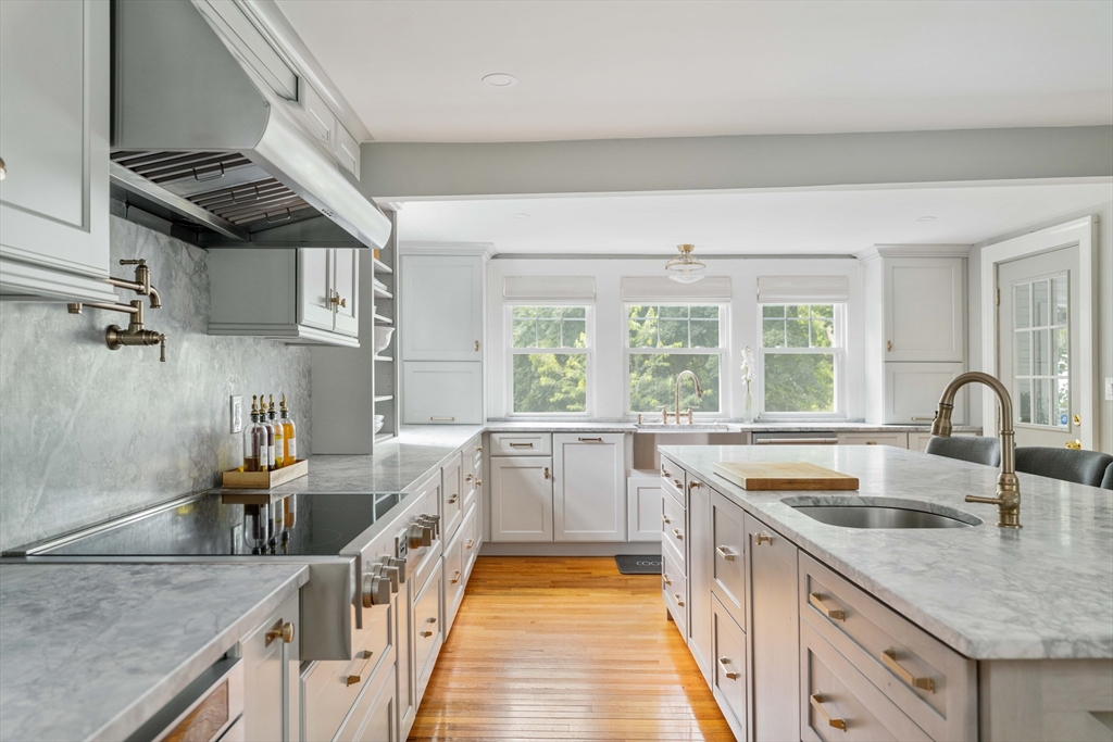 a kitchen with a sink and appliances