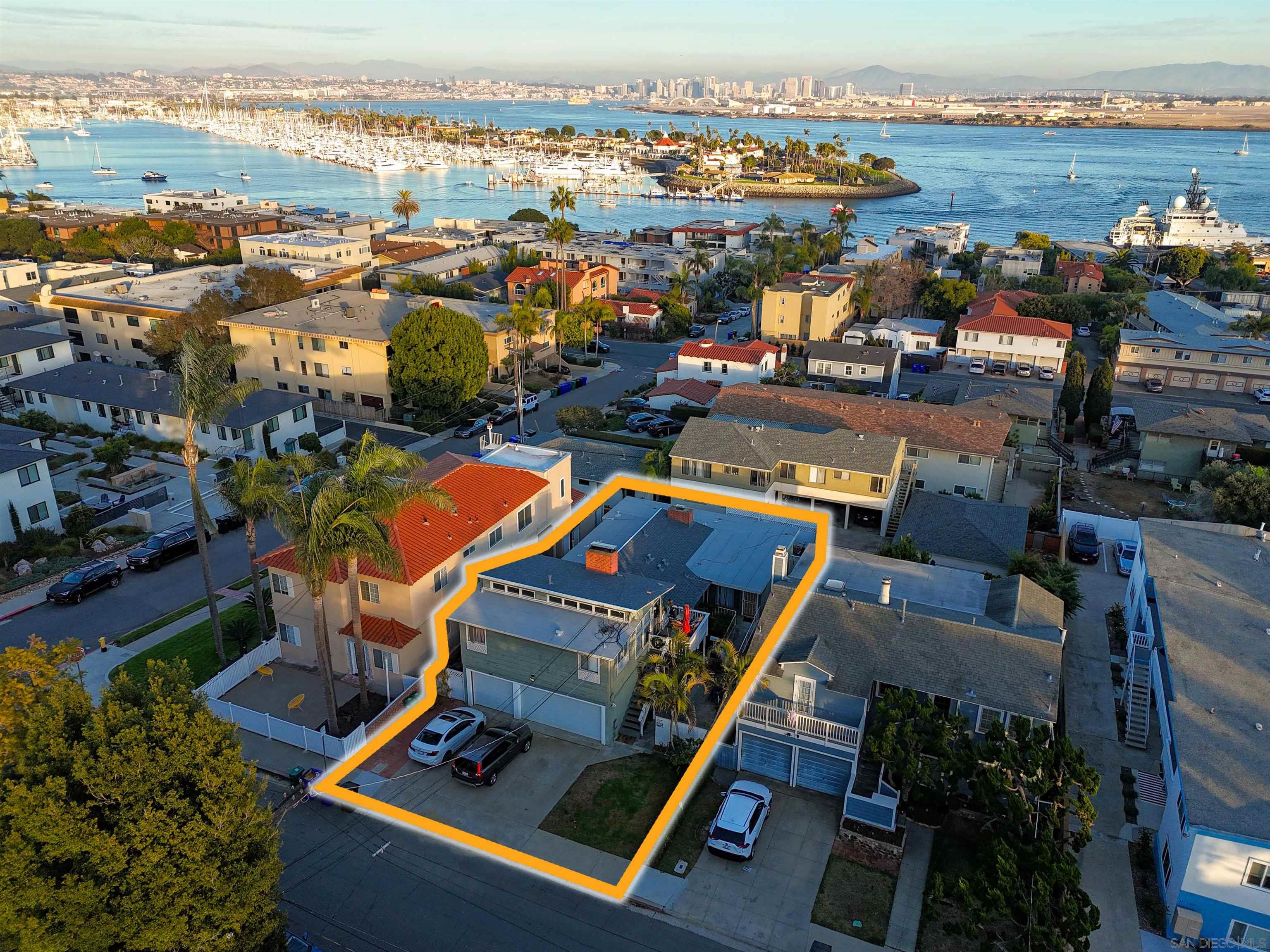 an aerial view of a tennis ground and city view