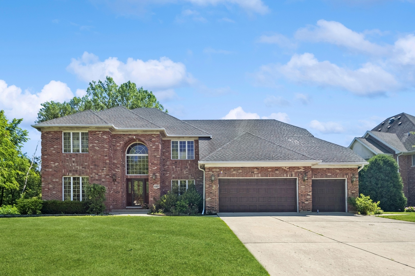 front view of a house with a yard