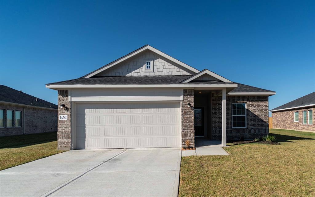 a front view of a house with a garage