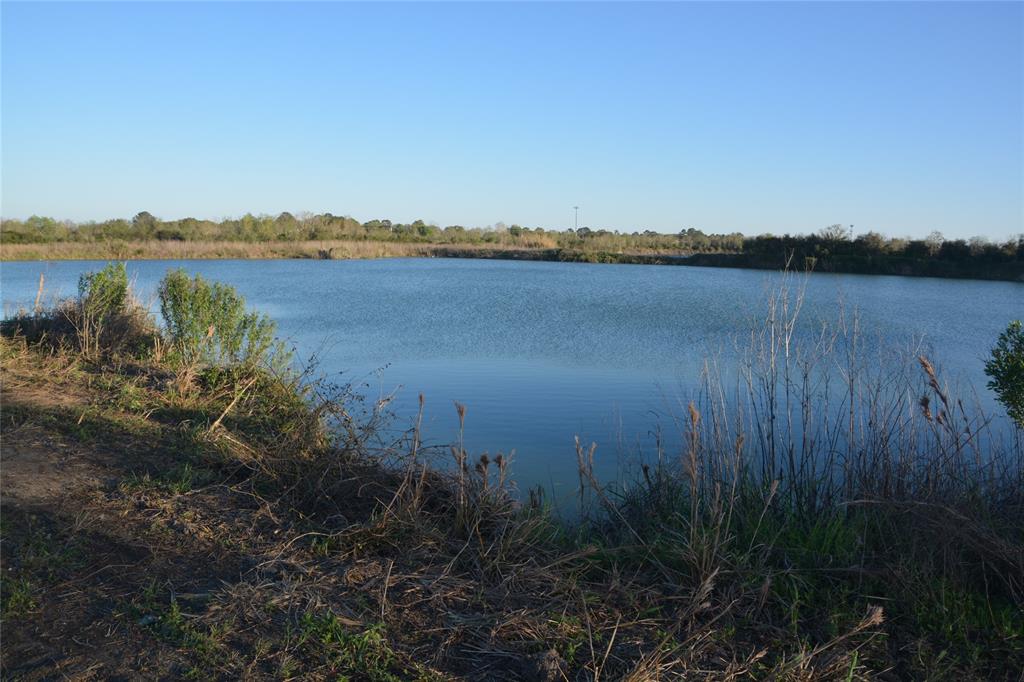 a view of a lake with houses in the back