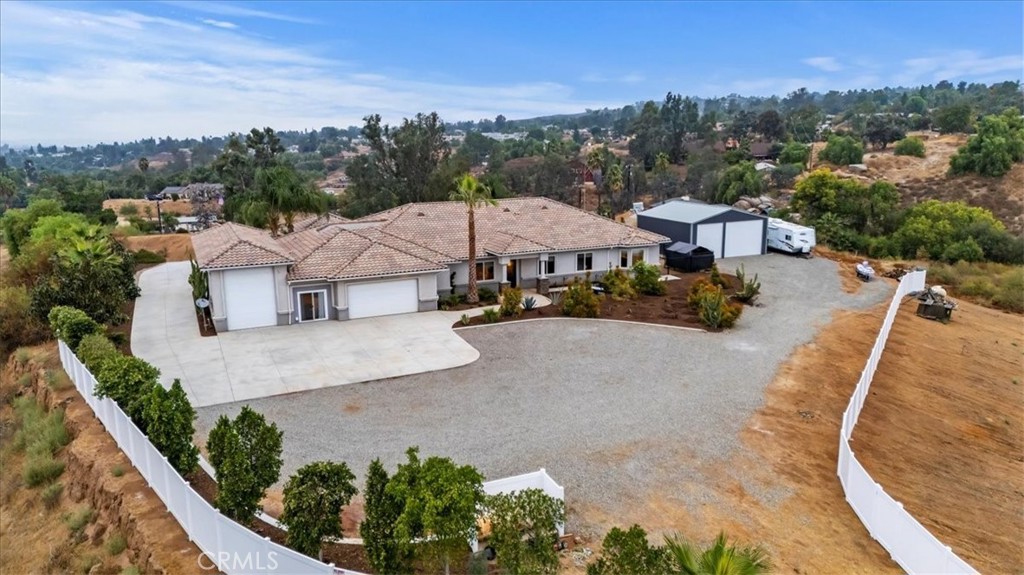 an aerial view of a house with a garden and plants