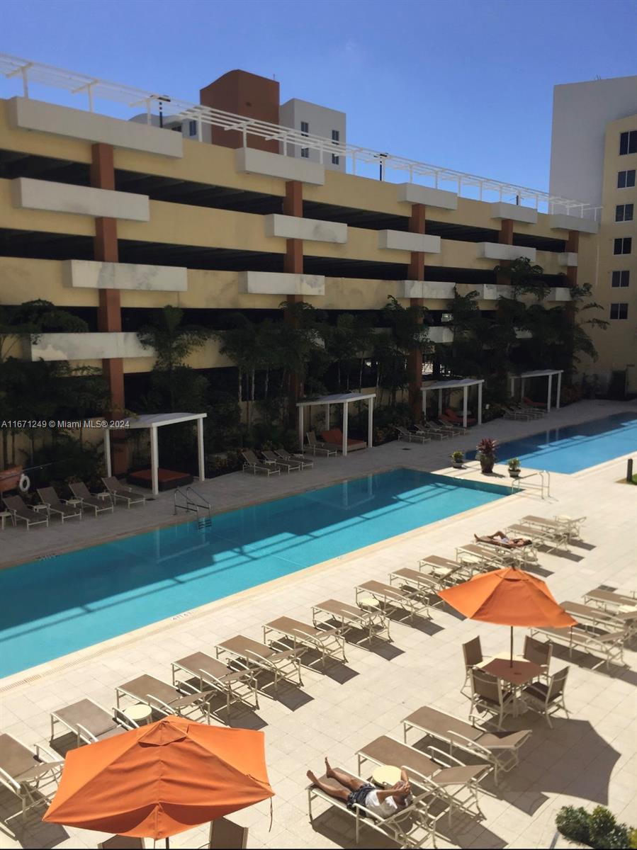 a view of a swimming pool with a lounge chairs