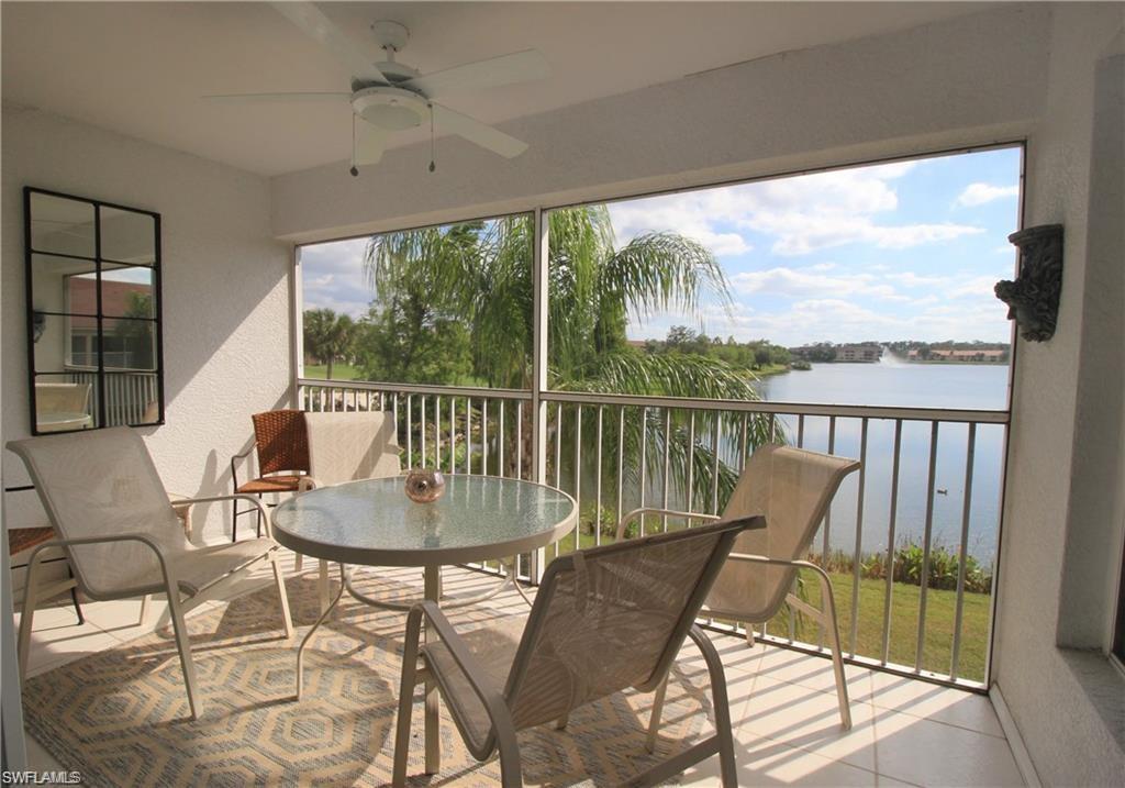 Sunroom featuring ceiling fan, a healthy amount of sunlight, and a water view