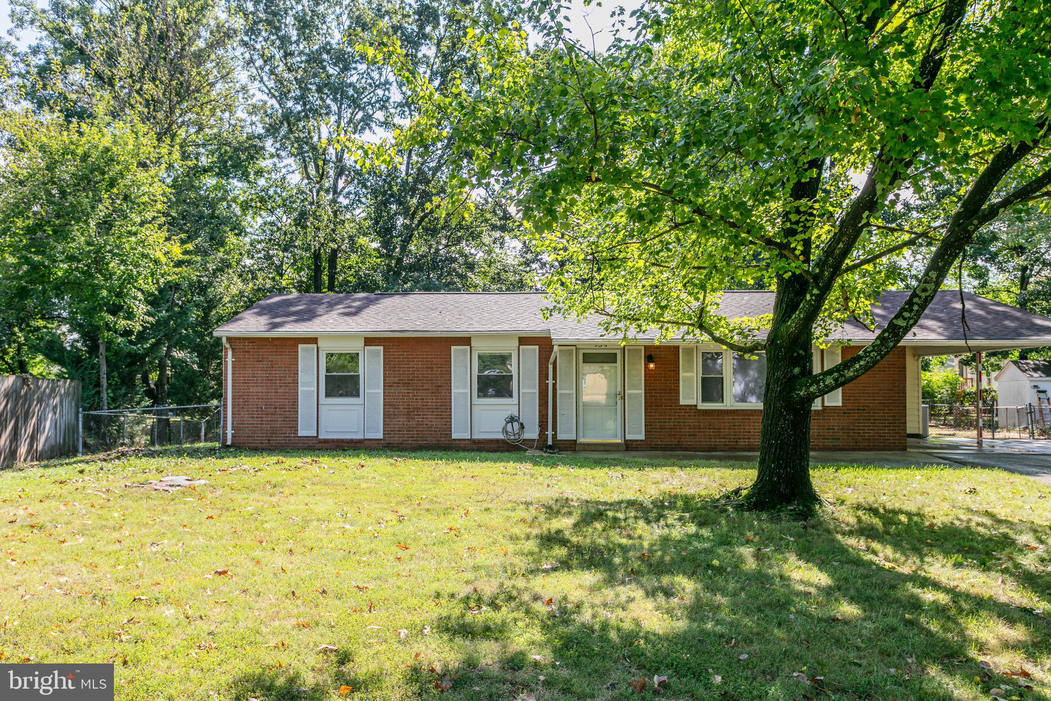 a front view of a house with yard