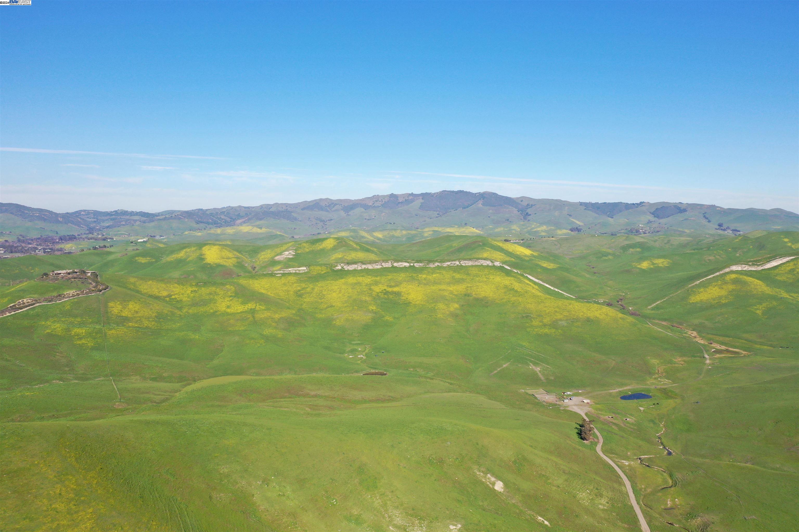 a view of an ocean from a mountain