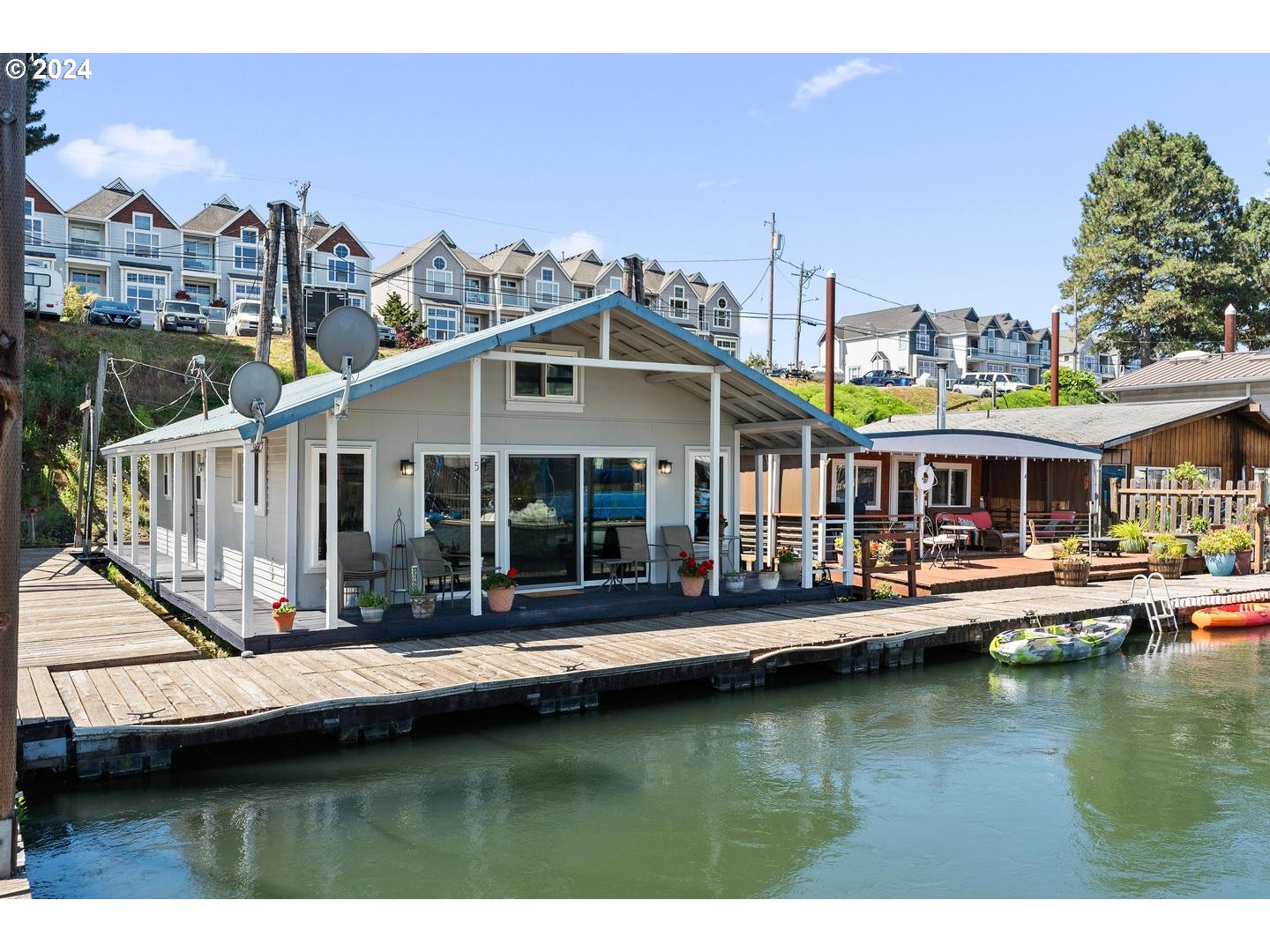 a view of house with swimming pool yard and outdoor seating