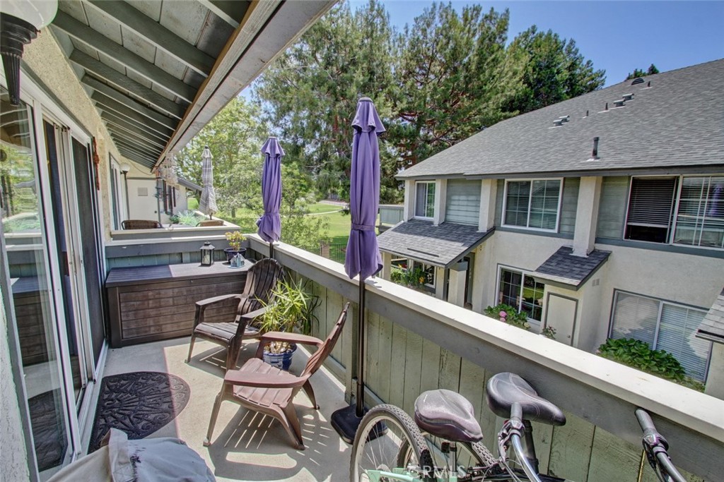 a view of a patio with couches chairs and potted plants