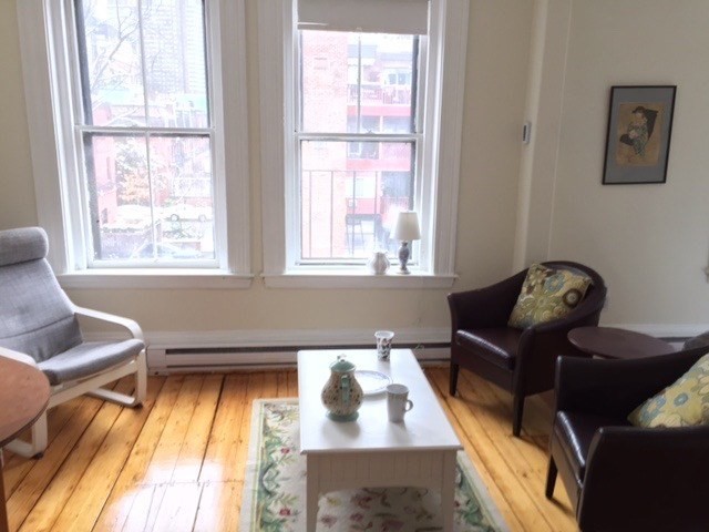 a living room with furniture and a window