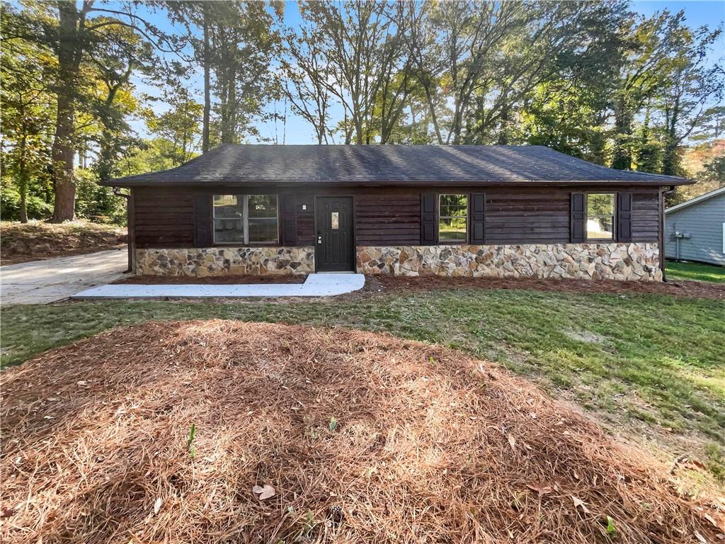 a front view of a house with a yard