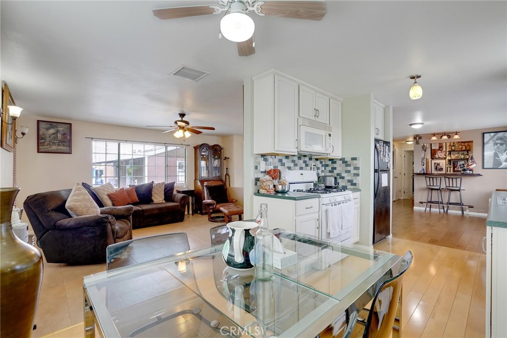 a kitchen with living room and living room