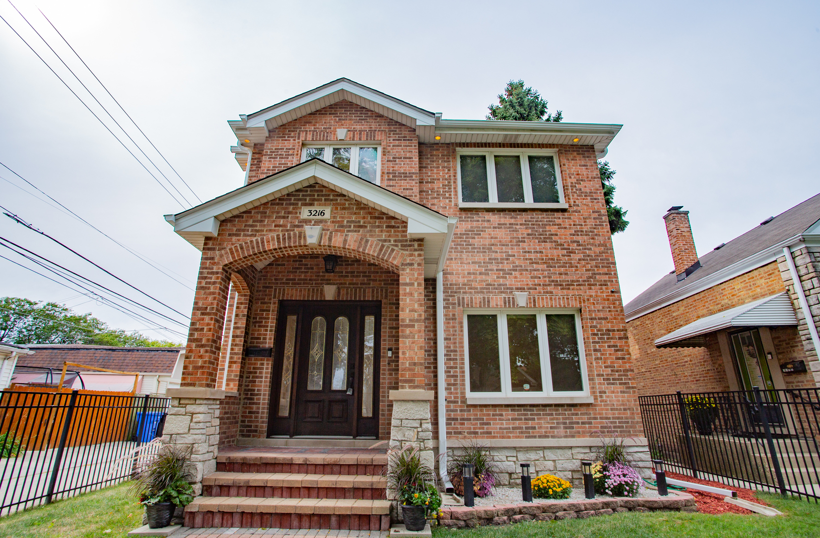 a front view of a house with garden