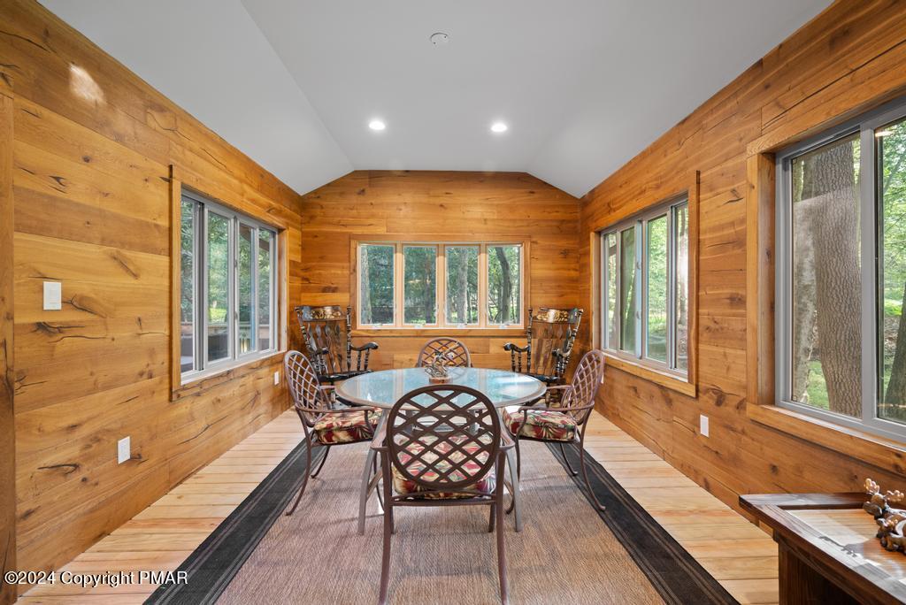 a dining room with furniture and windows