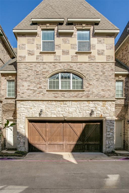 a front view of a house with a garage