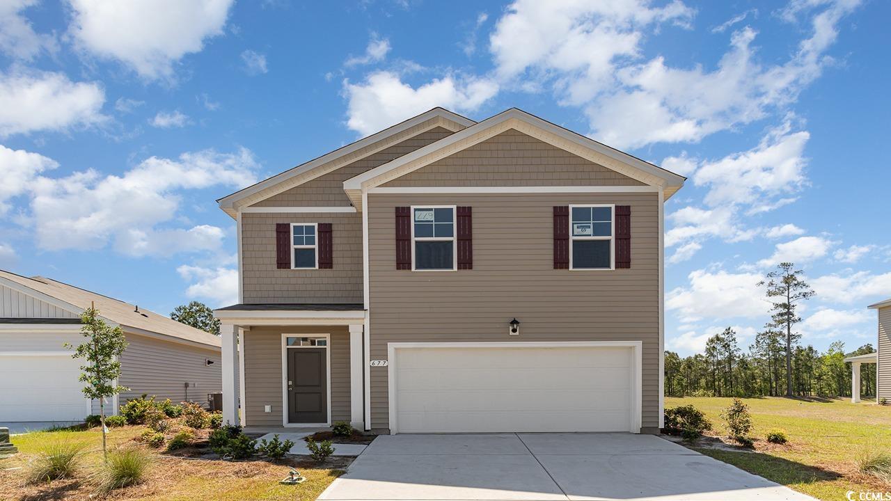 View of front of house featuring a garage