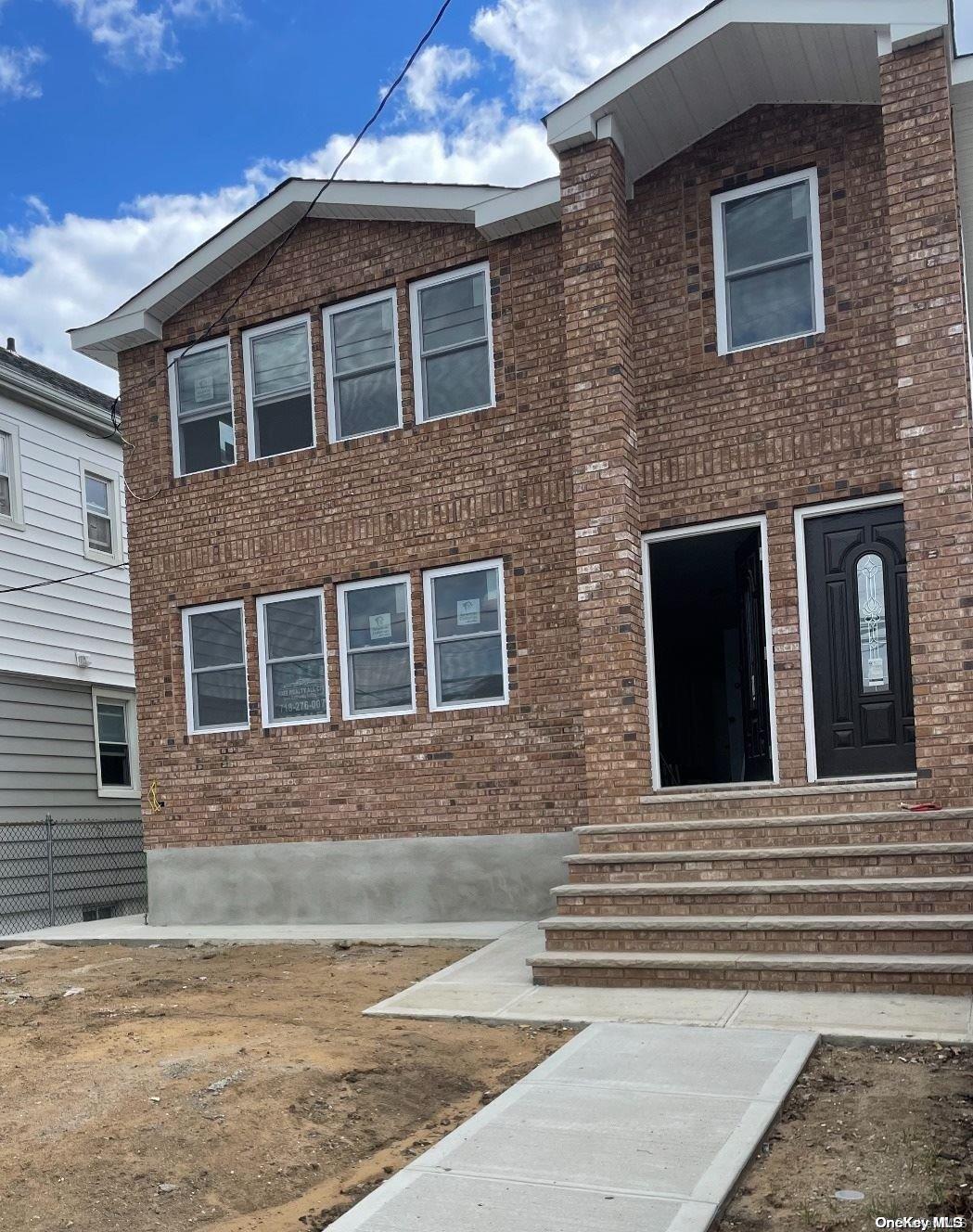 a brick house with a large windows