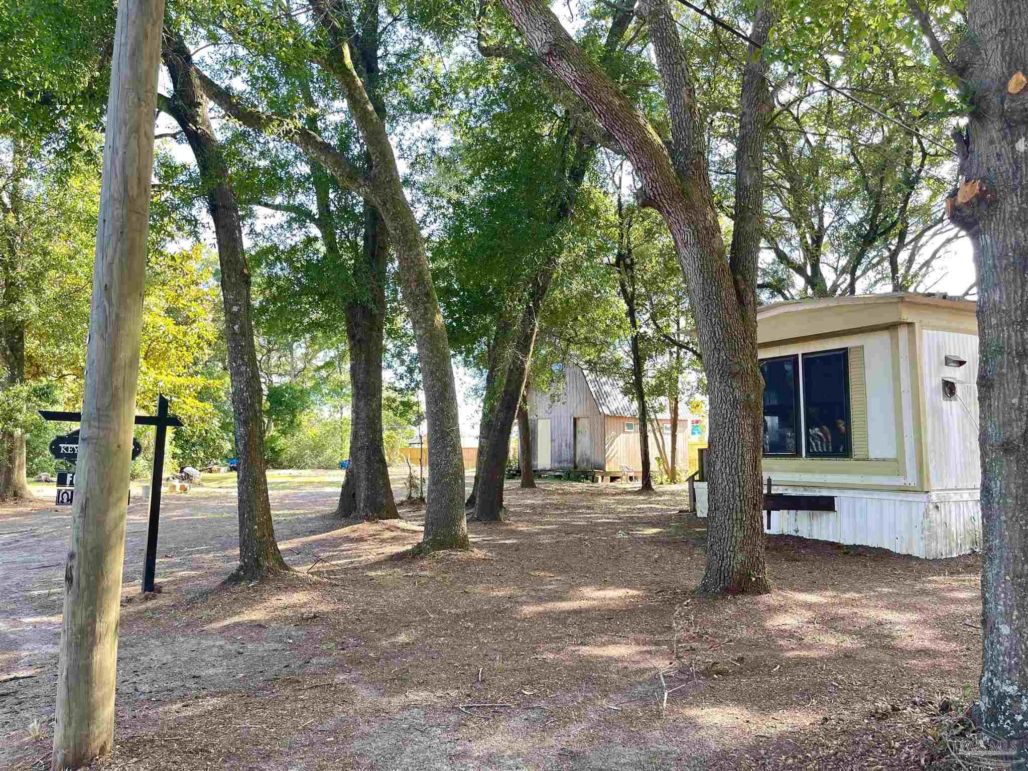 a view of outdoor space with deck and tree